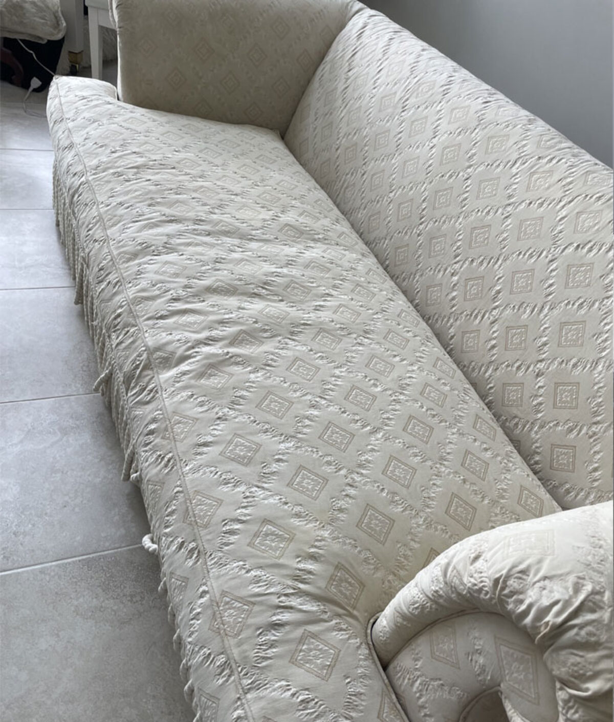 Cream damask sofa, before cleaning